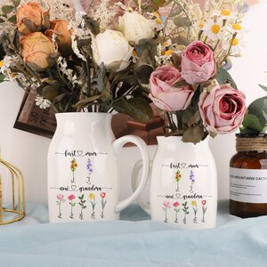 White ceramic garden flower vase with handle and small floral illustration print