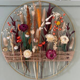 Autumn decoration with dried flowers. Gold floral hoop with jute twine. Wall decor for boho style house