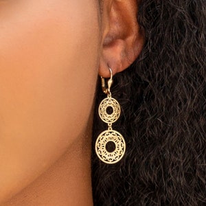 Gold chandelier earrings with flower-inspired circular drop design