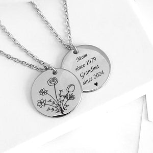 Silver-tone round mother-and-grandmother necklace pendant with engraved text and small floral design