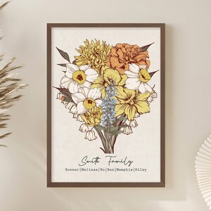 Framed family flower bouquet wall print with yellow, gold, and brown flowers and cursive text