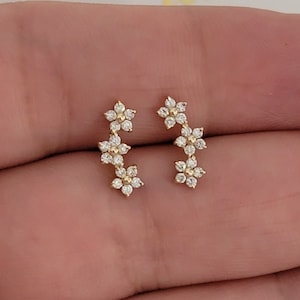 Diamond flower cluster climber earrings, curved 14k yellow metal with white stones