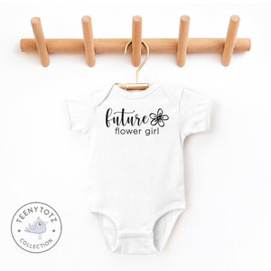 White baby bodysuit with 'future flower girl' graphic print