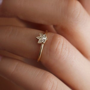 Silver-tone lotus flower ring with thin band and small engraved petals