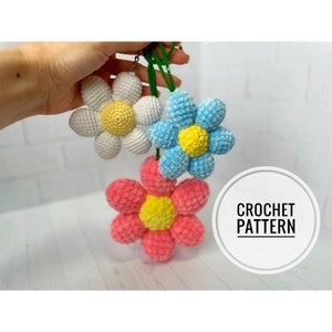 Crochet flower keychain pattern set with multi-color petals and green hanging loop