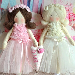 Pair of flower girl dolls wearing pink and cream lace tulle dresses
