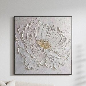 Textured canvas wall art with raised white flower petals and golden center, rectangular