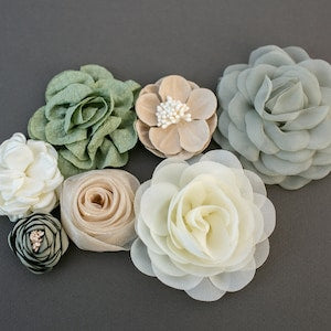 Fabric flower multipack with sage green, cream, beige, and pale blue fabric blooms