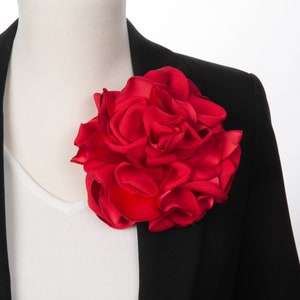 Red fabric flower brooch pin with layered rosette petals