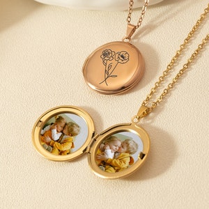 Gold round locket necklace with three small circular photo lockets and chains