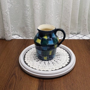 Hand-painted ceramic jug vase with dark blue-green checkerboard glaze and side handle