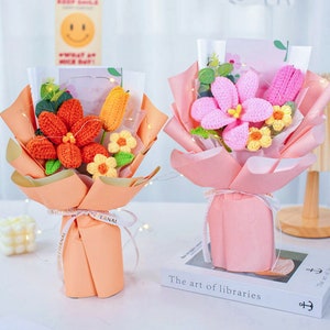 Handmade crochet flower bouquet with orange, pink, and green crocheted blooms, wrapped in paper