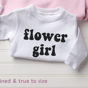 Kids crewneck sweatshirt in white with bold black 'flower girl' text
