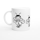 White kids mug with black line-art bunny, flower, and bee illustration on front