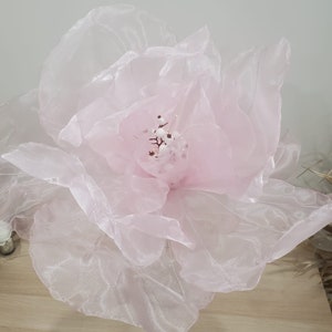 Pink organza flower head with layered petals and small center stamens