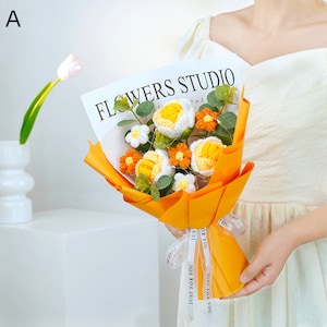 Handmade crochet flower bouquet with orange, white, and yellow roses in yellow wrap