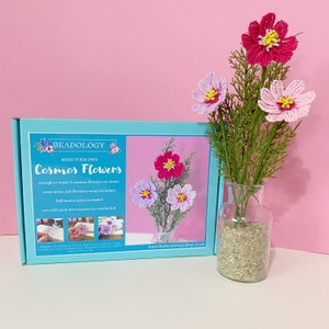 Blue flower craft kit box with printed beaded flower designs and a small bouquet in a vase
