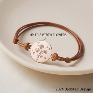 Personalized birth flower bracelet with round rose-gold tone charm on brown cord