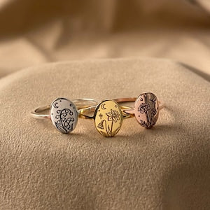 Floral birth month flower ring set with engraved flower faces in silver, gold, and rose