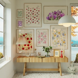 Set of nine framed floral wall art prints with butterflies, tulips, and hearts