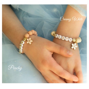 Kids beaded flower charm bracelet set with light beads and white flower spacers