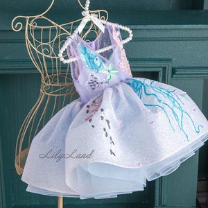 Iridescent glitter bodice baby dress with layered white tulle skirt