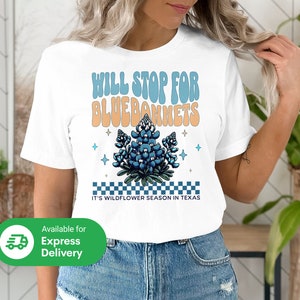 White T-shirt with bluebonnets wildflower graphic and “Hill Stop for Bluebonnets”