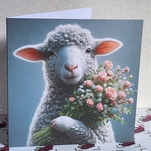 Handmade linen-effect sheep greeting card, square design: sheep holding pink flower bouquet.