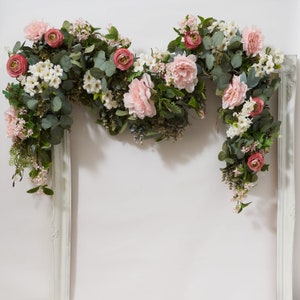 Artificial eucalyptus floral garland with pink and white flowers, arch-shaped