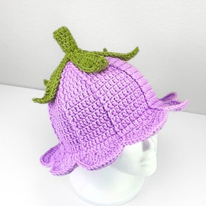 Crochet bucket hat pattern, purple knit hat with green lily-flower top
