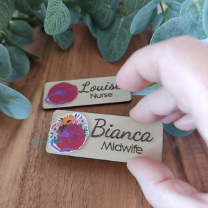 Personalized wooden ID badge with engraved names Louise Nurse and Bianca Midwife, floral accent