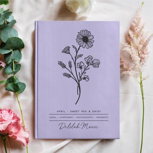 Lavender notebook with black floral line art and printed month flower text, Delilah Marie name