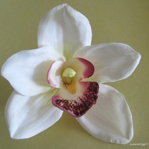 Cream orchid silk flower hair clip with white petals and purple center