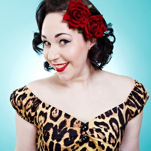 Red velvet rose hair flower clip on dark hair
