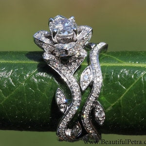 Floral diamond engagement ring set with leaf and rose lotus motif