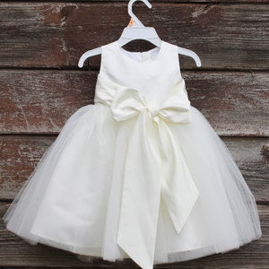 Sleeveless ivory lace bodice tulle flower girl dress with bow sash