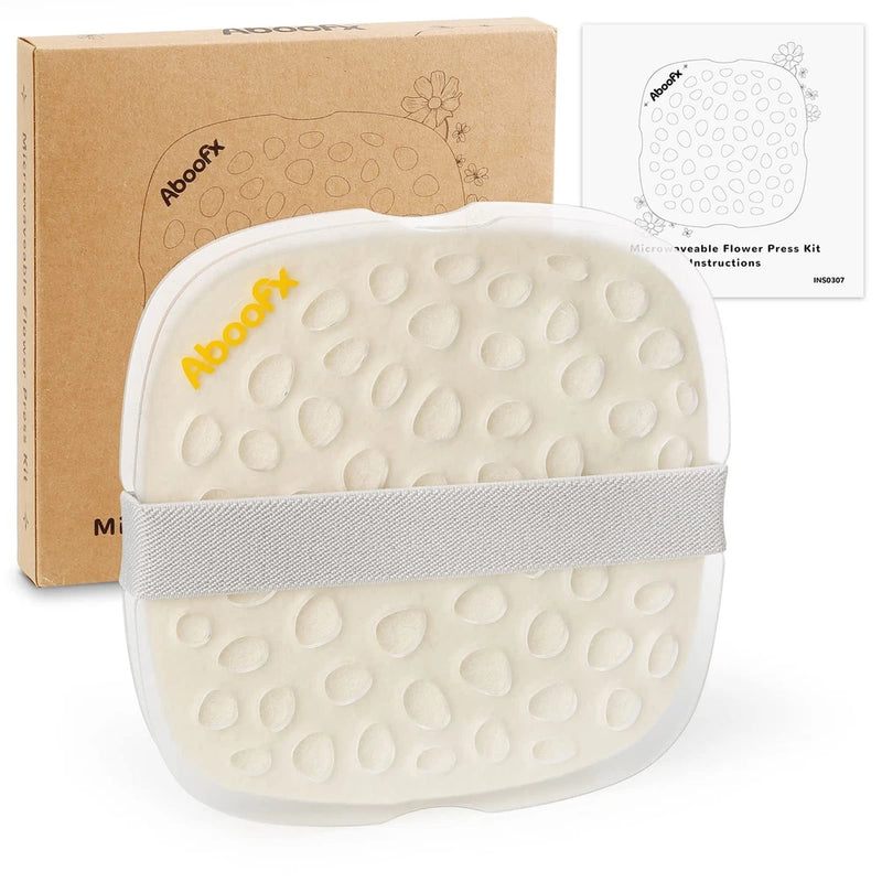 Microwave flower press kit with white textured drying pads and gray strap, compact oval design