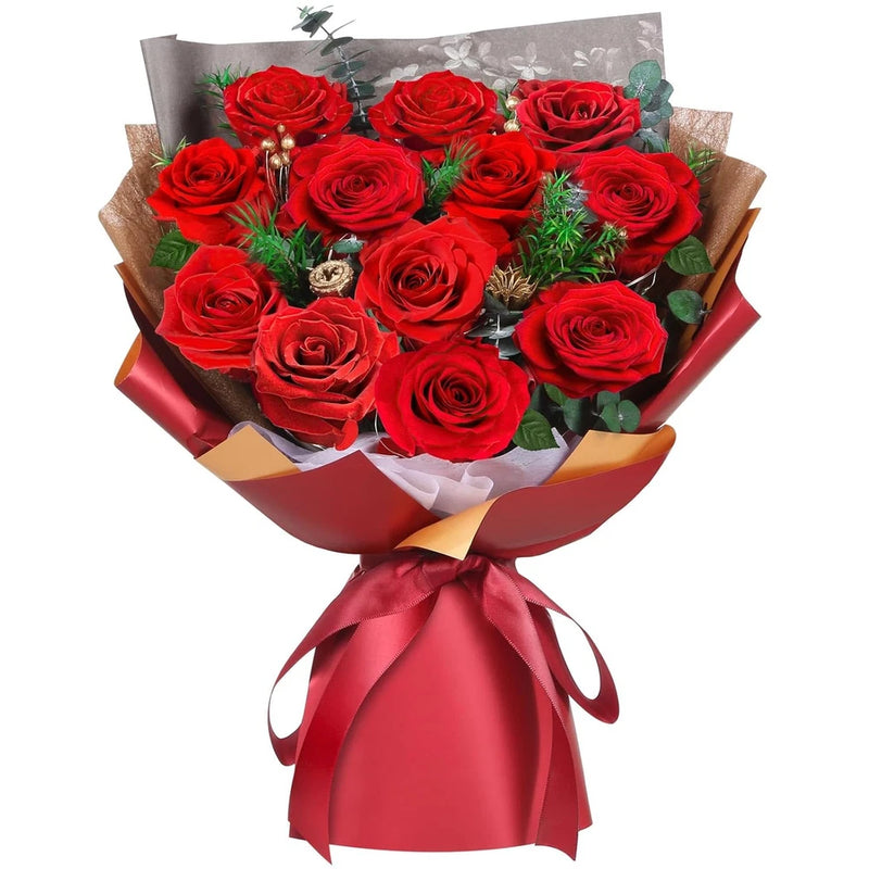 Preserved red rose bouquet with ribbon wrap and greenery accents