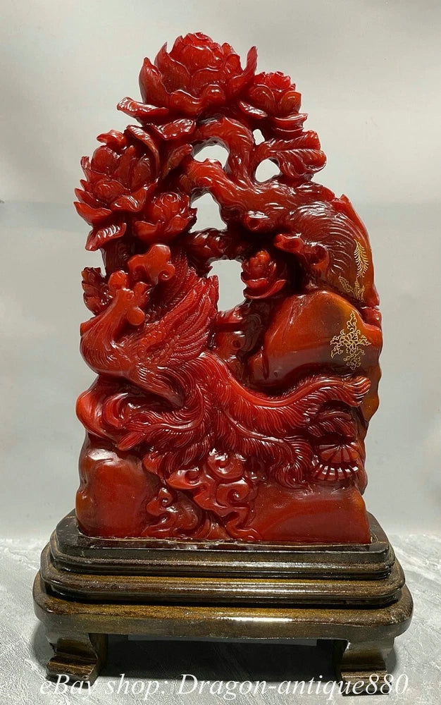 Red peony stone sculpture carving on dark base with ornate floral detail