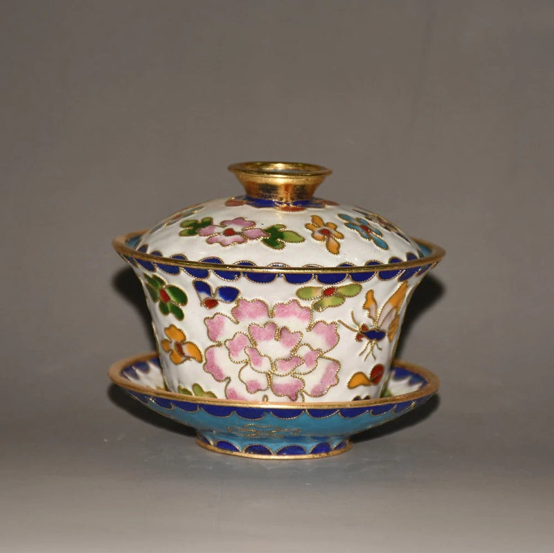 Cloisonne lidded bowl with peony and floral enamel pattern, blue and gold trim