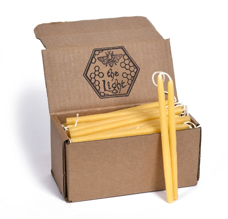 Beeswax candles bouquet in kraft gift box, several yellow candles with one tall centerpiece