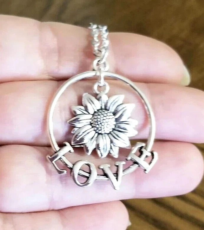 Silver sunflower pendant necklace with round hoop and LOVE charm