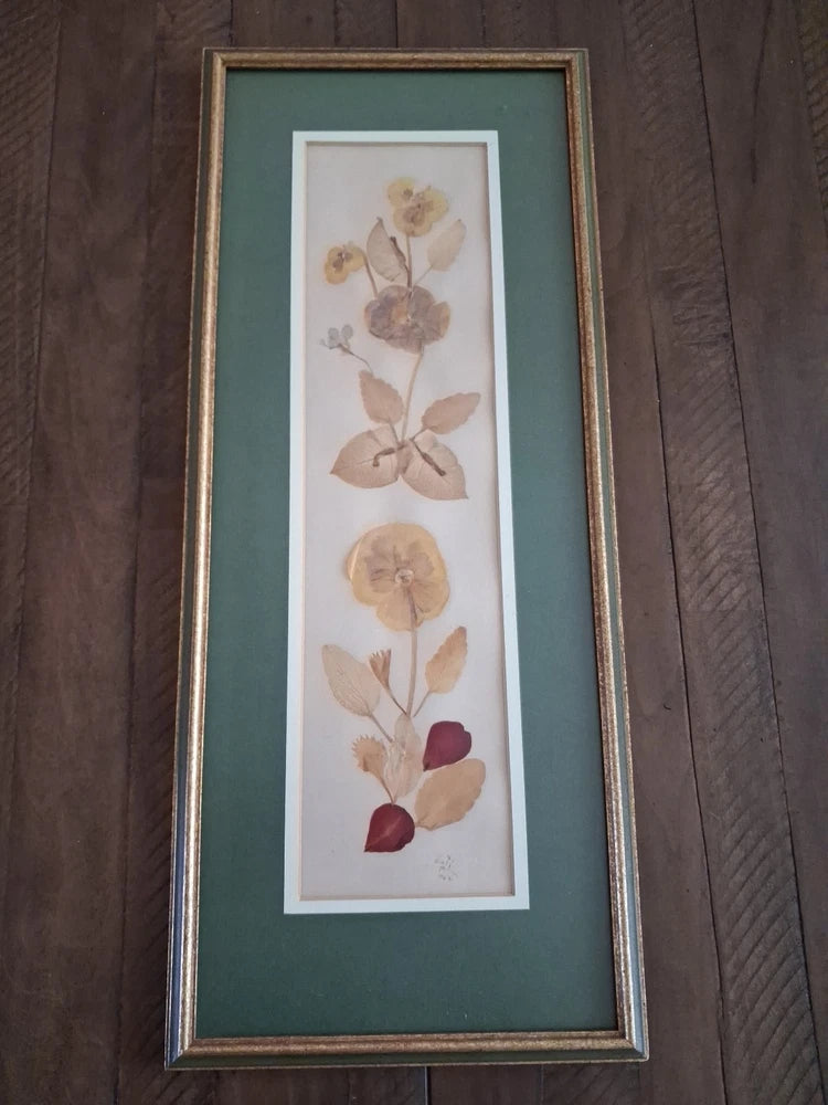 Framed dried flower botanical wall art with pressed flowers on off-white mat