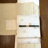 A summer obi with a neat design.Off-white with gold and silver awns and autumn Pampas Grass