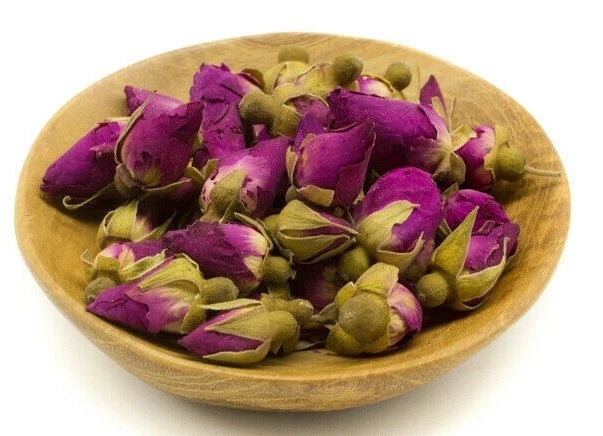 Bowl of dried small rose buds, purple petals with green buds