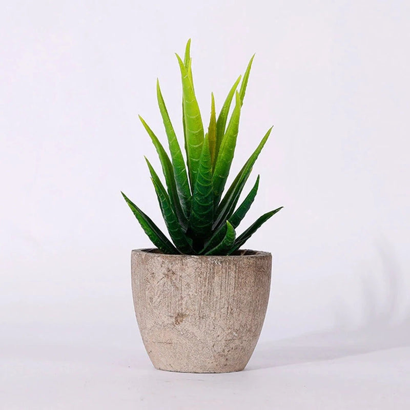 Artificial green succulent plant in textured beige stone-look pot