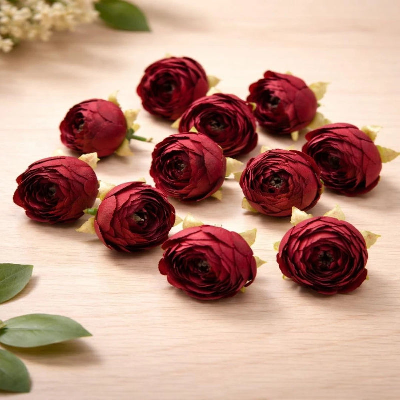 Set of artificial red fabric peony flower heads with green leaves