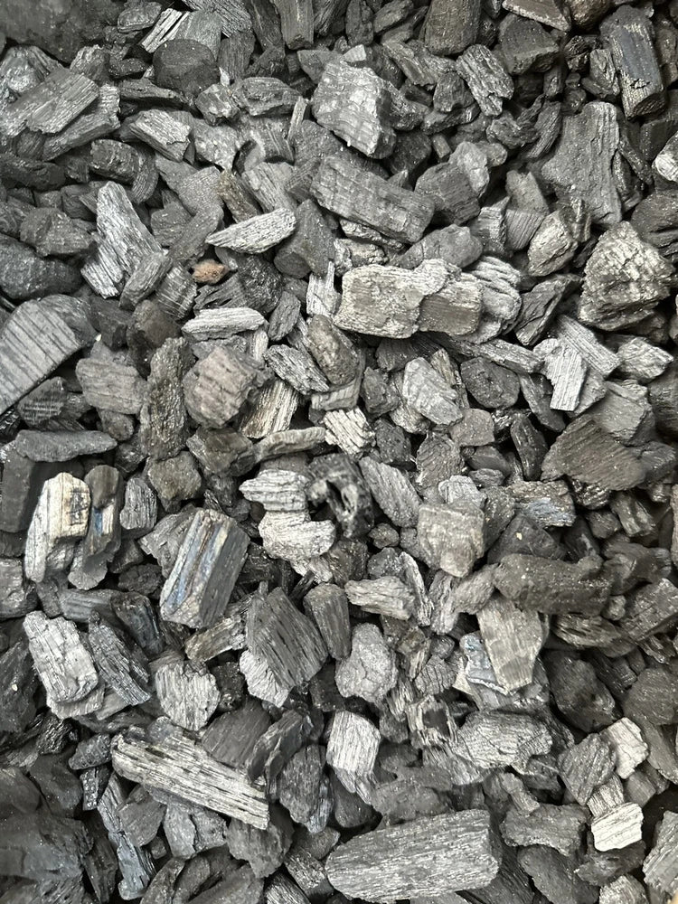 Horticultural orchid charcoal, dark gray chunks and gravel pieces