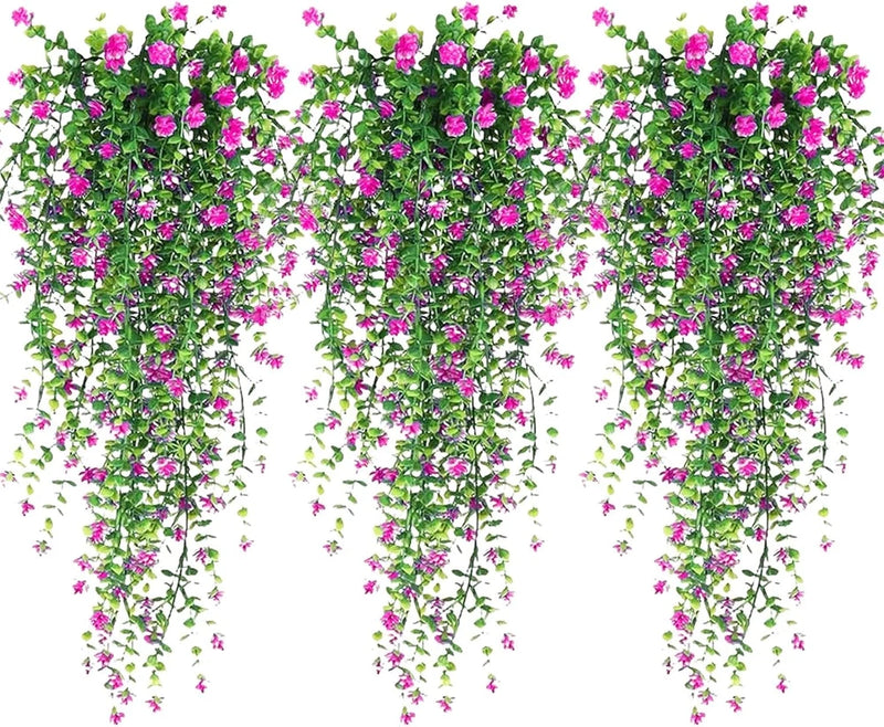 3 artificial hanging vines with small pink flowers and green leaves