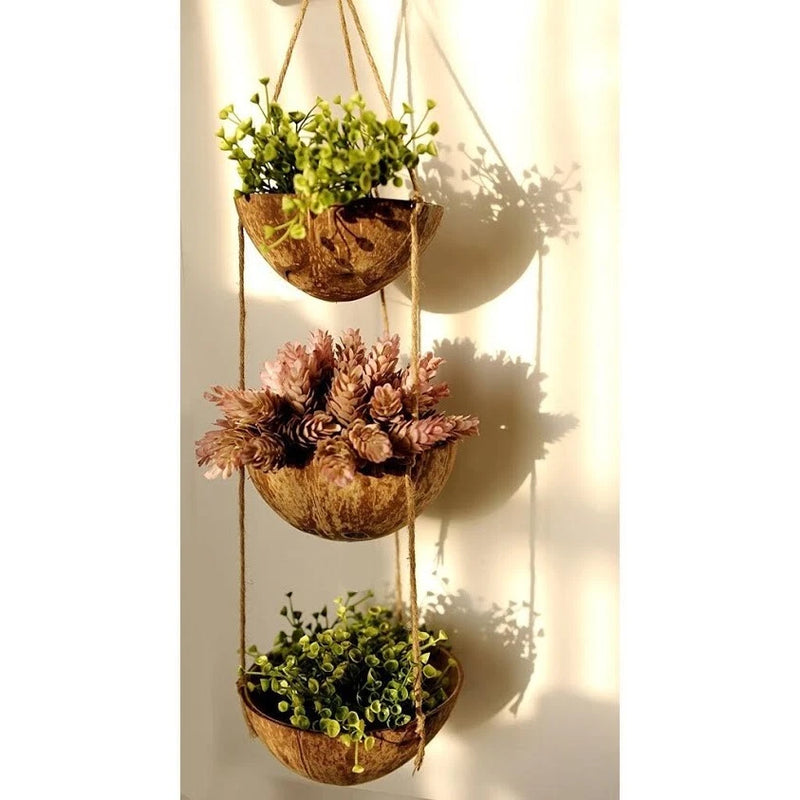 Hanging coconut shell planter set with three tiers and rope loops for flowers